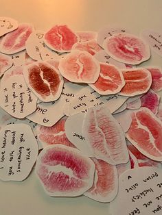 several pieces of paper that have been cut into hearts with words written on the side