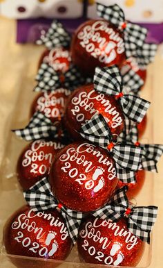 some red and black candies with bows on them