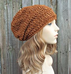 "Style: Slouchy crochet hat. Color: This sample hat is shown in \"Top stitch\", the orange stitching color you see on blue jeans. Sizes: One size fits average teen or adult head size of 20\" to 23\" (50.5 cm to 58 cm). Fiber Content: 100% acrylic Characteristics: Very soft, bohemian and cozy. Care Instructions: Hand wash, dry flat. Every item from Pixiebell is handmade and knit or crocheted to order, unless otherwise stated in title of the item as \"ready to ship\". Production time may vary, ple Bonnet Au Crochet, Orange Beanie, Slouchy Hats, Fall Fashion Accessories, Crochet Hood, Crochet Slouchy Hat, Orange Hat, Crochet Hat For Women, Orange Hats