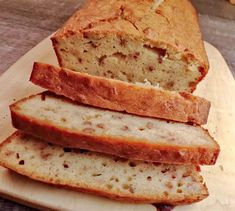 three slices of bread sitting on top of a cutting board