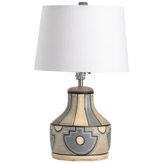 a table lamp with a white shade on the top and a gray design on the bottom