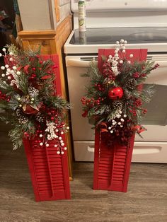 two red shutters with christmas decorations on them