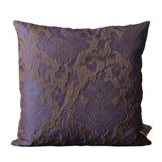 a purple and brown pillow on a white background