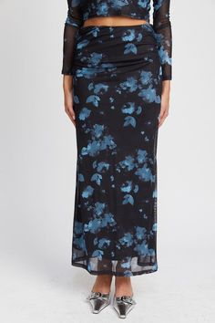 This Floral Sheer Maxi Skirt offers comfort and a sleek look. It is crafted from a blend of 92% polyester and 8% spandex, while the lining is 100% polyester, providing a lightweight and breathable fit. Ideal for any occasion. SIZE & FIT :MODEL WEARS SIZE SMALLMODEL'S HEIGHT 5'9 Floral Sheer Maxi Skirt Details : Made In: IMPORTED Fabric Contents: 92% POLYESTER, 8% SPANDEXLINING: 100% POLYESTER Emory Park is a Young Contemporary clothing brand based in Los Angeles. We are committed to produ... Long Blue Mesh Skirt, Floral Mesh Midi Skirt, Rushed Mesh Black Skirt, Whimsical Skirt, Skirt With Flowers, Floral Mesh Top, Long Black Skirt, Sheer Maxi Skirt, Mesh Maxi Skirt