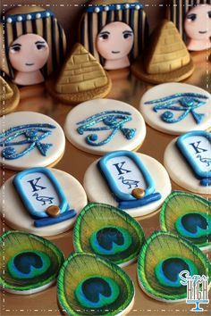 decorated cookies with peacock feathers and egyptian symbols