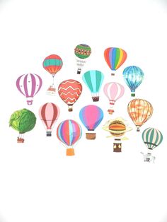 many hot air balloons flying in the sky