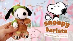 a hand holding a small crochet stuffed dog in front of a pink background with the words snoopy barista written on it