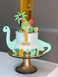 a birthday cake with dinosaur decorations on top