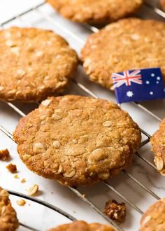 anzac cookies cooling on a rack with an australian flag pin