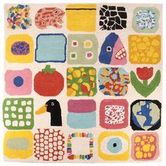 a colorful rug with many different shapes and sizes