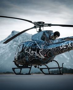 the helicopter is painted with designs on it