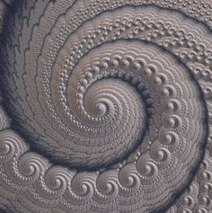 an image of a spiral design made out of paper