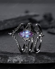 Rhodium black engagement ring like no other. This AMAZING piece of fine jewelry is the perfect expression of your eternal love. Its BLACK colors bring out the beauty of this ring. Alexandrite is the gemstone of luck, prosperity, and intellect. The alexandrite gemstone shines different colors in different lights. Under white light it shines more green and shines purple and blue under yellow light and daylight. More black gold rings ,please click here: https://www.etsy.com/shop/ShainGem?section_id Alexandrite Ring And Black, Gothic Party Ring Jewelry, Gothic Party Ring, Gothic Open Ring Jewelry For Anniversary, Gothic Promise Ring Jewelry, Gothic Open Ring For Anniversary, Gothic Black Crystal Promise Ring, Gothic Black Promise Rings, Gothic Black Promise Jewelry