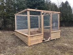 a chicken coop in the middle of a field