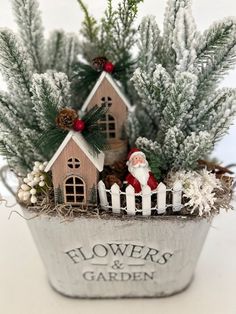 a metal planter filled with christmas decorations