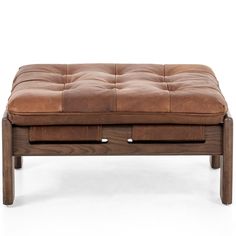 a brown leather ottoman with two drawers on it's sides and an open drawer underneath