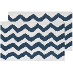 two blue and white rugs with wavy lines