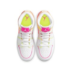 The colorful Nike Air Jordan 1 Mid GS "Edge Glow" gives the classic silhouette a neon twist. With white premium leather as the backdrop, all detailing such as the ankle and heel panels, Swoosh and eyestay are outlined with neon materials. Grab the "Edge Glow" if you want all eyes on you. Now available in children's sizes. Swag Shoes Nike, Neon Jordans, Nike Colorful Shoes, Colorful Basketball Shoes, Nike Shoes Colorful, Preppy Jordans, Neon Nikes, Neon Nike Shoes, Gold Nike Shoes