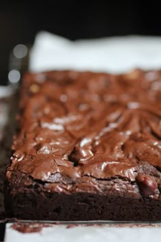 a chocolate cake sitting on top of a white plate