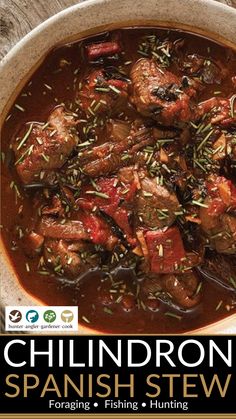 a bowl filled with meat and vegetables on top of a wooden table