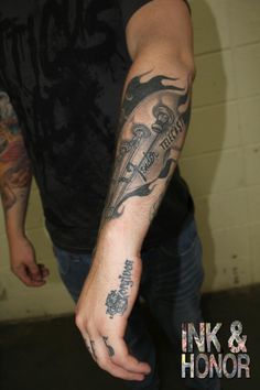 a man with a tattoo on his arm