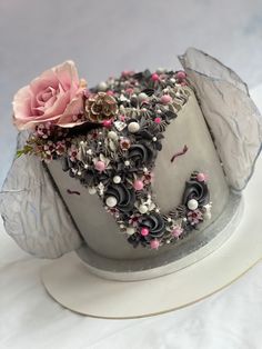 there is a cake decorated with flowers and icing