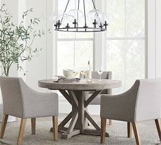 a dining room table with chairs around it