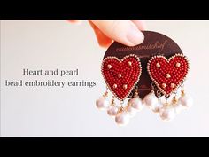 a pair of red heart and pearl bead embroidery earrings with pearls