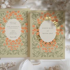 an orange and green wedding card with flowers on it