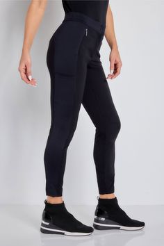 Meet our Ipant. Perfect for any traveler who loves the no-fuss quality of leggings but with a dash of refinery, the Ipant Hybrid Zip Front Slim Fit Pant is the perfect jet-setting essential. This piece is designed with a comfortable zip-front style with high-performance materials and a comfortable spandex and signature stretch blend. Streamlined seams at the front and the back pair perfectly for a travel-ready pant that is perfect for any adventure. Slim fit Skinny leg with ankle-length hem Mid- Versatile Tight Black Pants, Sleek Tight Bottoms For Pilates, Stretch Bottoms With Pockets For Travel, Black Leggings With Pockets And Comfort Stretch, Sleek Stretch Pants For Yoga, Stretch Activewear For Travel, Versatile Stretch Bottoms With Elastic Side Panels, Black Stretch Activewear With Tapered Leg, Versatile Stretch Pants With Elastic Side Panels