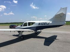 a small airplane sitting on top of an airport tarmac