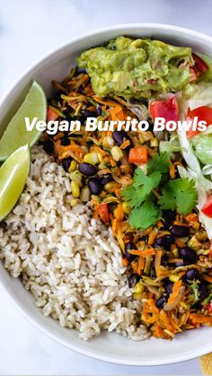 a white bowl filled with rice, black beans and guacamole next to a lime wedge