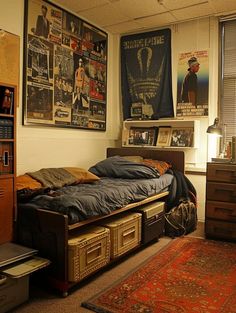 a bedroom with posters on the wall and a bed in front of a dresser next to a window