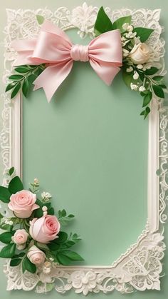 an ornate frame decorated with pink roses and greenery on a mint green background photo