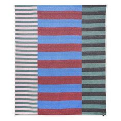 a multicolored rug with different stripes on the front and back of each piece