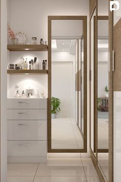 the interior of a modern home with white walls and flooring, open shelving