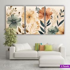 three floral paintings hanging on the wall above a couch in a room with white furniture