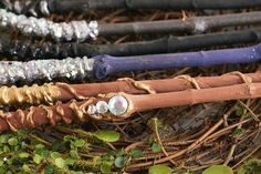 an assortment of different colored canes laying on the ground