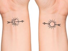 two wrist tattoos with arrows and an arrow on the left side of each arm,