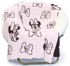 a mickey mouse blanket sitting on top of a chair