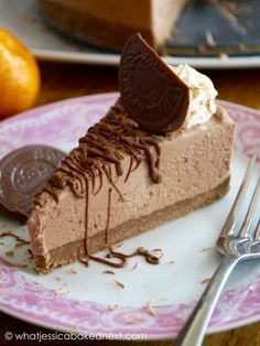 a slice of chocolate pie on a pink and white plate