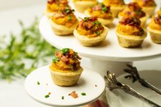 small appetizers are arranged on three tiers