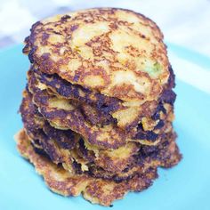 a stack of pancakes sitting on top of a blue plate