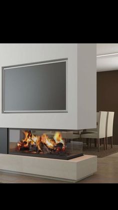 a modern fireplace with fire burning in it