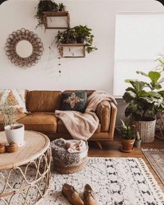 a living room filled with furniture and plants