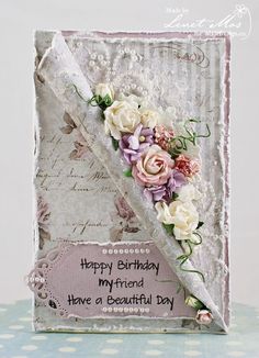 a birthday card with flowers on it