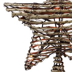 a sculpture made out of branches and wires on a white background with light bulbs in the center