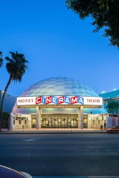 an empty street in front of a movie theater