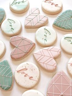 decorated cookies are arranged on a table