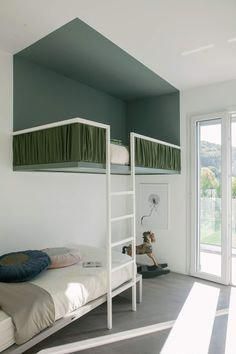 a bedroom with two bunk beds and a sliding glass door